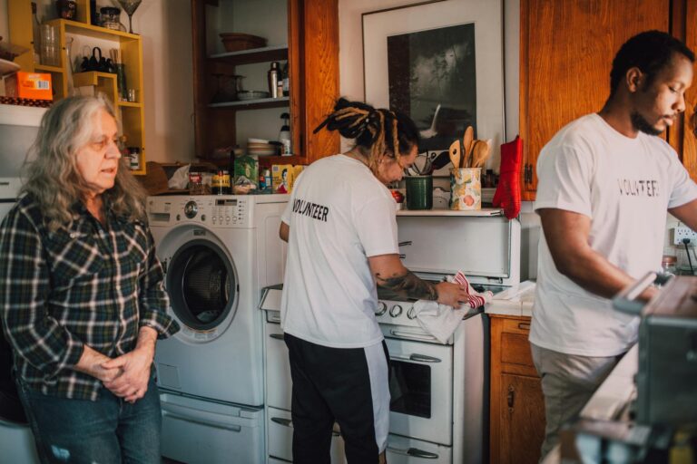 Volunteers preparing food in a community kitchen to support local charity efforts.