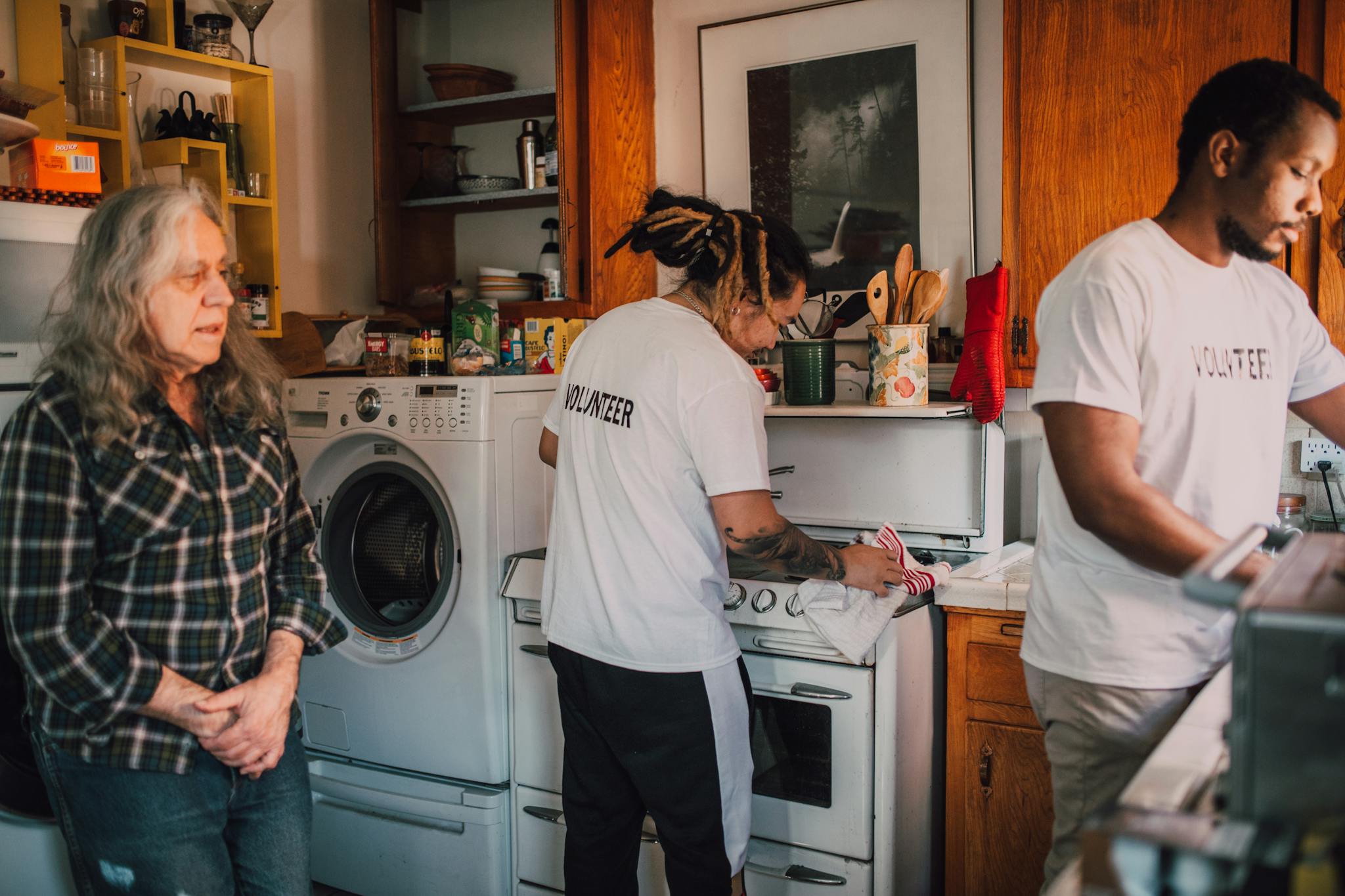 Volunteers preparing food in a community kitchen to support local charity efforts.